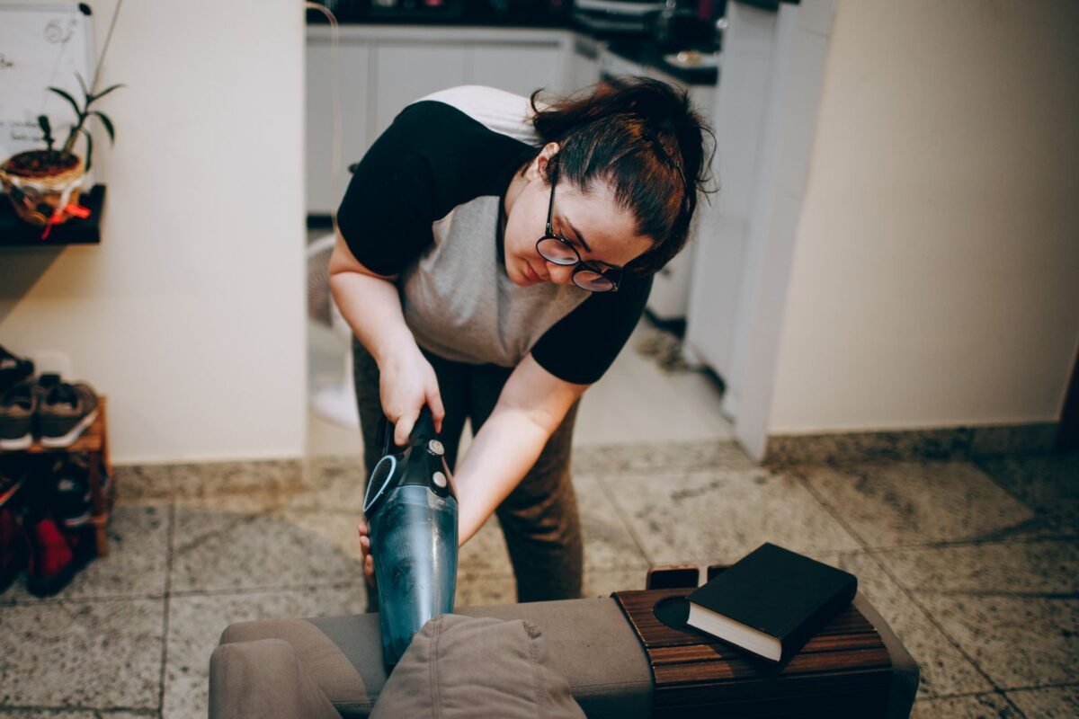 Upholstery cleaning across a sofa cushion